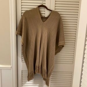 Tan poncho with fringe and gold shimmer